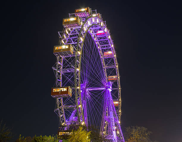 Vienna, Austria - November 12, 2015: A view of the Wiener Riesenrad in Prater from outside the park at night during the end of Autumn