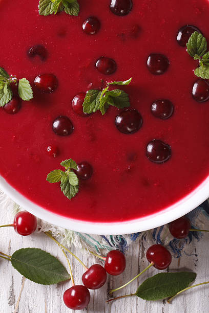 istock delicious cold cherry soup in bowl macro. vertical top view 497188906