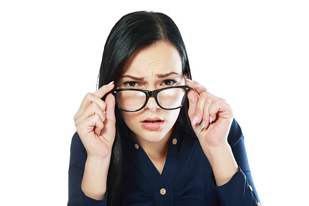 istock woman looking over glasses 497190974