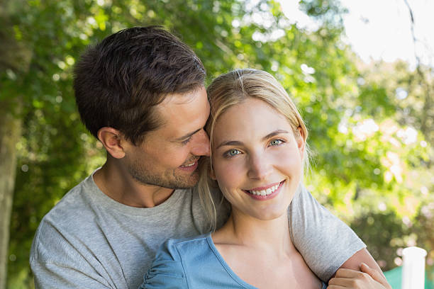 istock Loving young couple in park 497198485