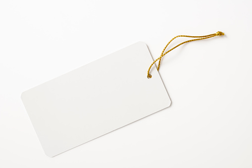 Blank white tag with gold string isolated on white background with clipping path.