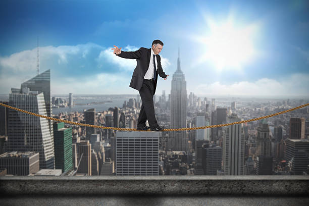 istock Composite image of mature businessman doing a balancing act 497201001