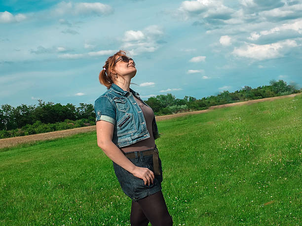istock Spring meadow woman enjoying nature 497201593