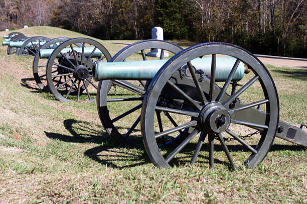 Civil War Canon on Battlefield in Vicksburg Row of cannons in the battlefield  in Vicksburg National Military Park in Vicksburg, Mississippi vicksburg stock pictures, royalty-free photos & images