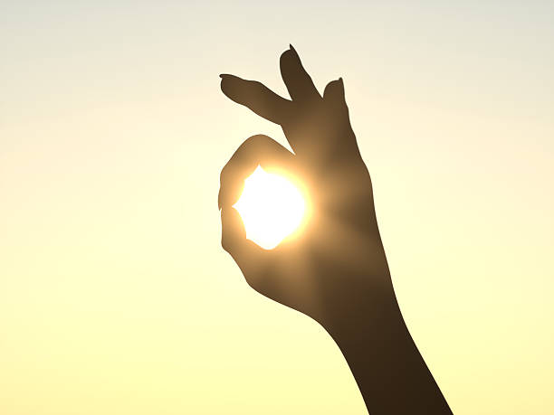 istock It's All Right - Hand in front of Sun 497202689