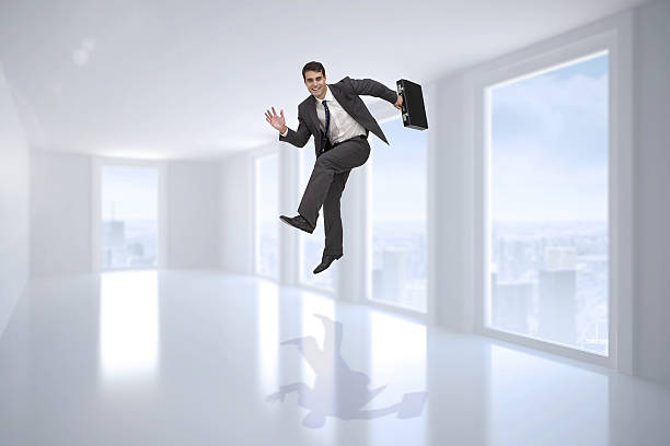 istock Composite image of smiling businessman in a hurry 497203969