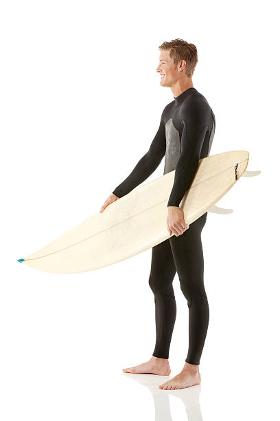 istock Side view of happy man standing with surfboard 497204481