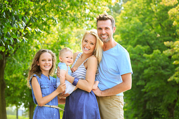 istock Happy family in a park 497204511