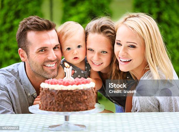 Family Celebrating First Birthday Stock Photo - Download Image Now - 12-23 Months, Adult, Baby - Human Age