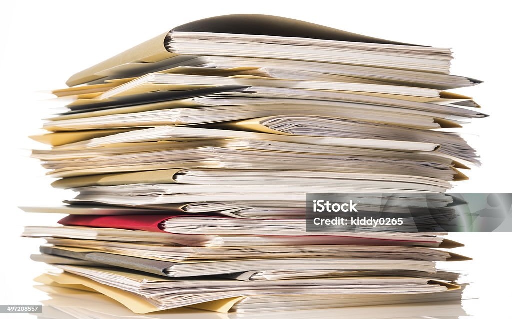 Files. Pile of paperwork on office desk table.On white background with copy space. Business Stock Photo