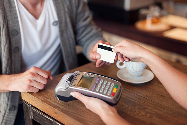 istock Close up of customer paying by credit card 497208841