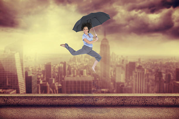 istock Composite image of happy classy businesswoman jumping while hold 497209519