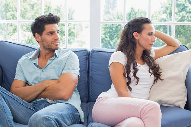 istock Upset couple not talking to each other on couch 497209567