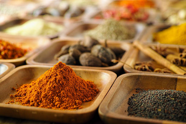 istock Indian spices in wooden trays. 497210562