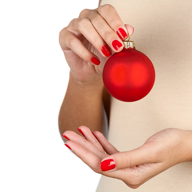 istock Holding christmas ball 497212911