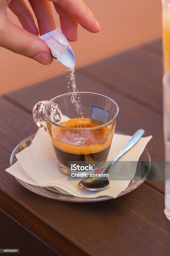 Coffee Unrecognizable person pouring sugar into cup of coffee, copy space Coffee - Drink Stock Photo