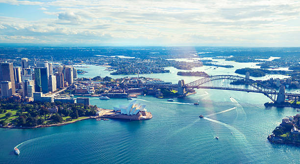 Aerial view of Sydney Harbor in Australia Aerial view of Sydney Harbor in Australia with bridge and opera house sydney harbor stock pictures, royalty-free photos & images