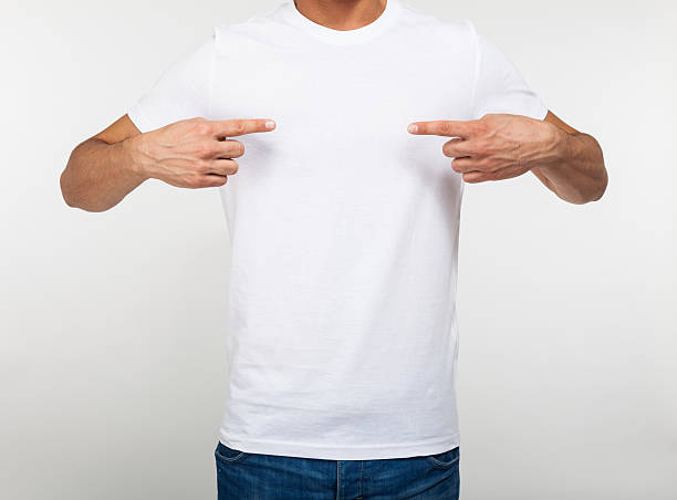istock Man pointing his fingers on a blank t-shirt 497213417