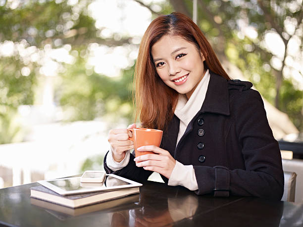 istock young woman in coffee shop 497213467
