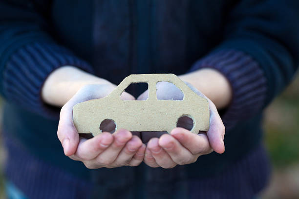 istock young homeless boy holds a cardboard car 497213512