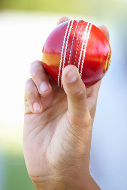 Time for an exciting game of cricket Cropped shot of cricket ball held in a handhttp://195.154.178.81/DATA/i_collage/pi/shoots/783317.jpg vibrant color lifestyles vertical close up stock pictures, royalty-free photos & images