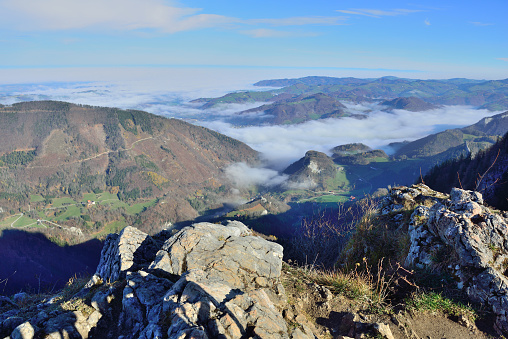 Northern Limestone Alps in Upper Austria with autumn fog over valley of river Enns seen from summit of mount \