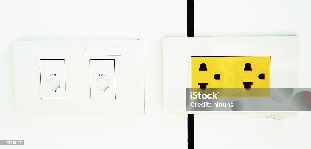 Yellow electrical outlet electrical outlet, yellow color is a sign that if the arbitrary power outage, has the power flow throughout machine at any time. Accessibility Stock Photo