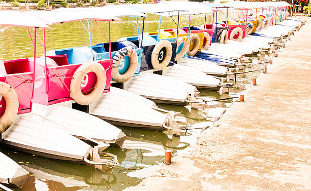 istock line of colorful paddle boats 497215560