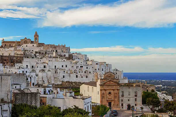 From the ancient town,up the hill,you can admire beautifull landscapes:it is the Valle d'Itria characterized by sea,by 'trulli'dry stonewalls that  surround vineyards and olive groves as far as the eye can see.Ostuni is a succession of arches,towers,palaces,courtyard,terraces,alleys,noble mansions and shops.