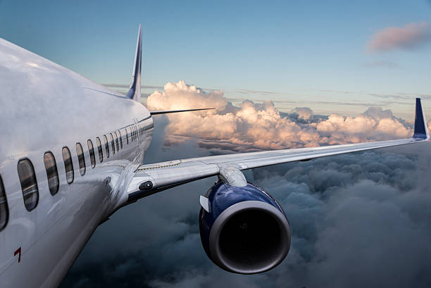 istock Body of an Airplane Flying Above Cloud 497217174