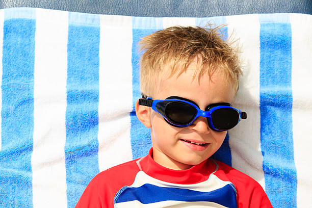istock cute happy little boy at beach vacation 497217824