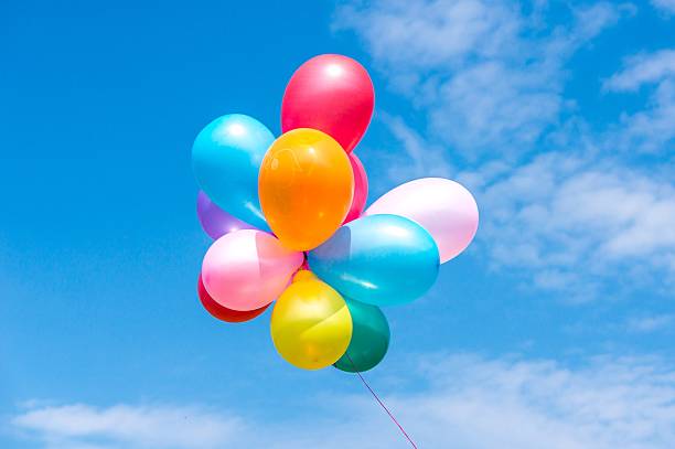 istock Colorful balloons in the blue sky 497218420