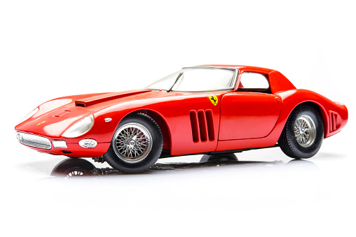Kampen, The Netherlands - March 25, 2014: Red Ferrari 250 GTO model car studio shot isolated on a white background.