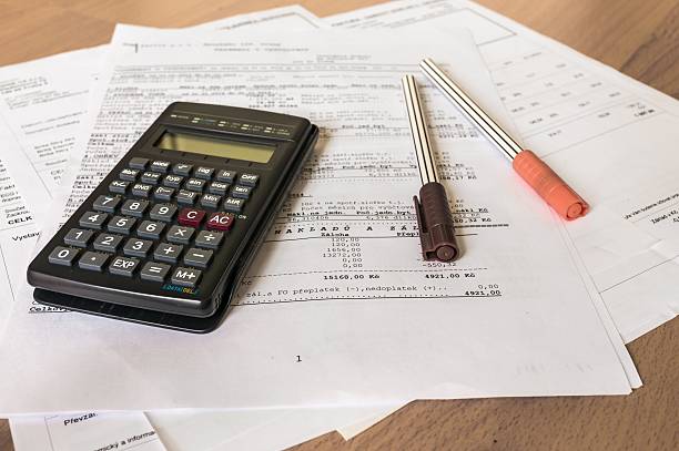 istock Calculator and pens on bank statement on the table 497219782