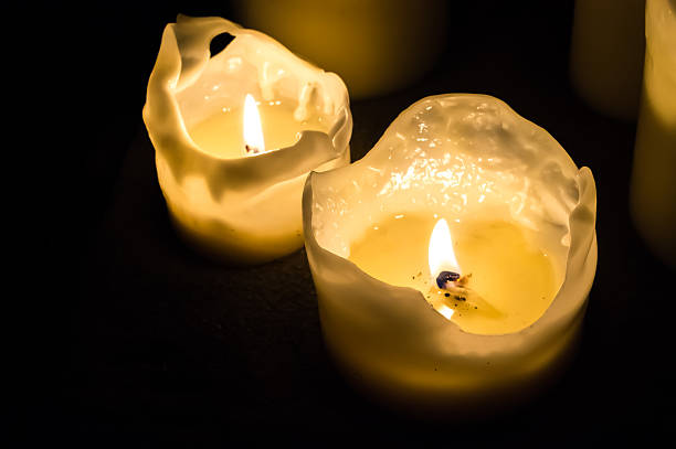 istock Candle flames at night in the dark background 497220114