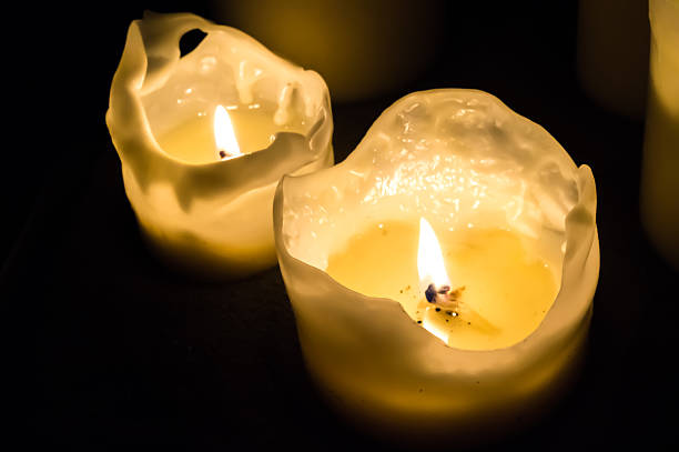istock Candle flames at night in the dark background 497220138