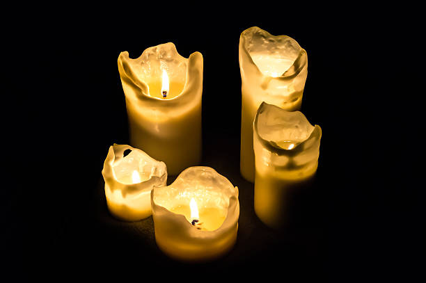 istock Candles at night isolated in the dark background 497220156