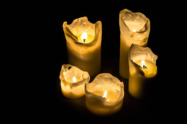 istock Candles at night isolated in the dark background 497220200