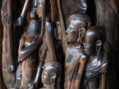 Arusha Region, Tanzania - October 15, 2015: Typical African wood sculptures sold as souvenirs in one of many stores in Arusha region, Tanzania, Africa.