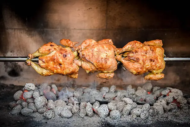 Photo of Cooking 3 rotisserie chicken on the grill with Charcoal