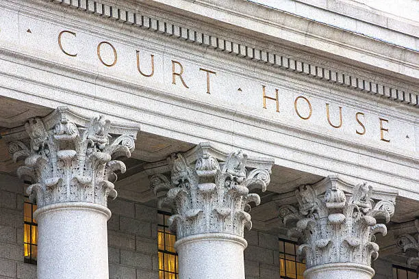 Facade of courthouse with columns.