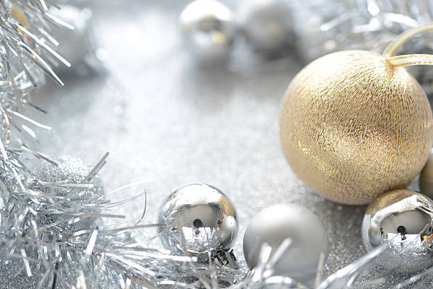 istock gold and silver christmas ball on glitter background 497222068