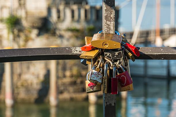 istock Love padlocks on a railing in the harbor 497223282