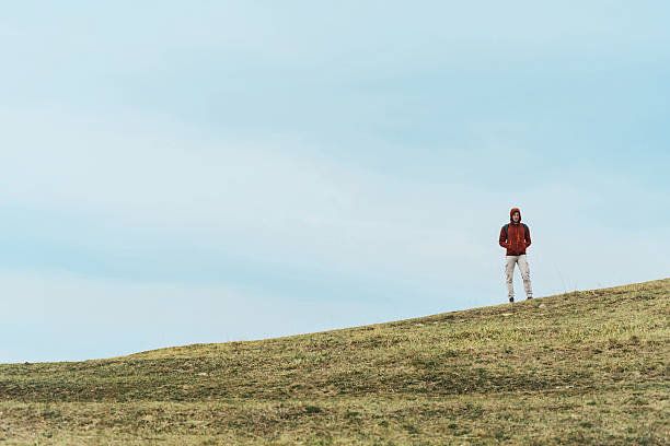 istock Hiker man standing on the hill 497223698