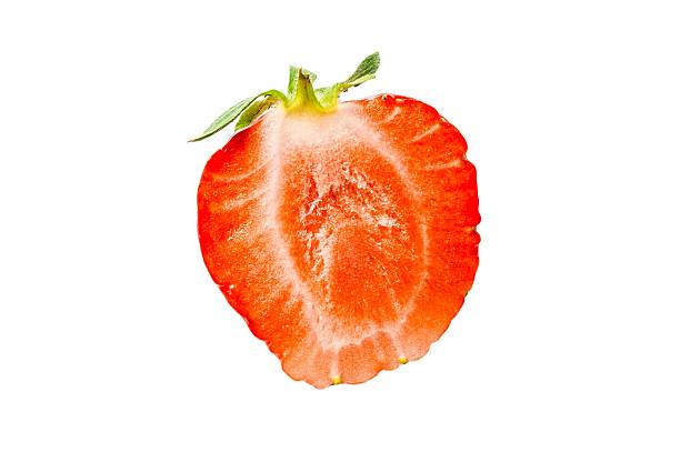 istock One half of strawberry isolated on a white background 497225116