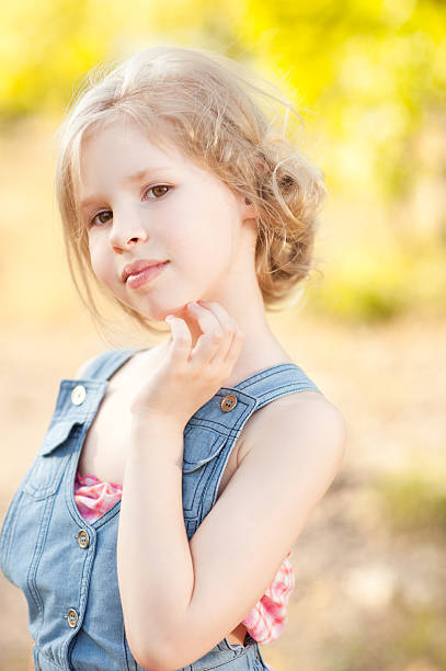 istock Pretty kid girl posing outdoors 497225593