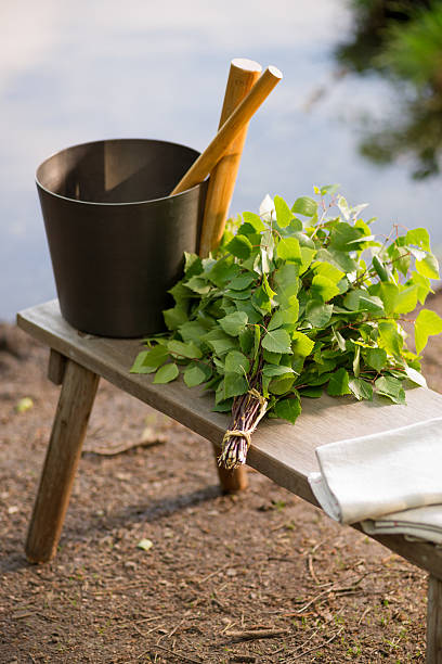 istock Sauna objects on wooden bench before lake at summer 497226511