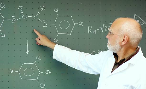 istock Man showing something on the blackboard 497227045