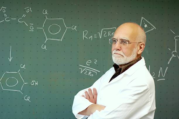 istock Man standing in front of a blackboard 497227049