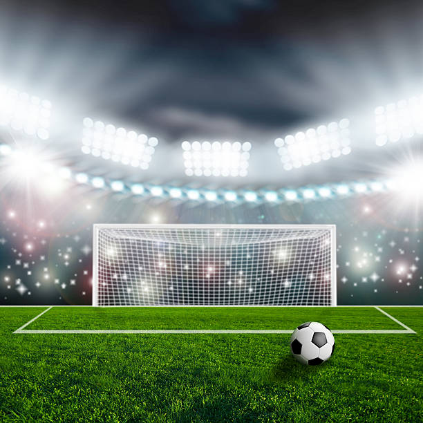 istock Soccer ball on green stadium arena 497227303